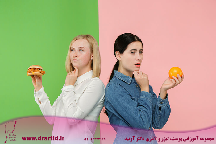 dieting concept healthy useful food beautiful young women choosing fruits unhealthy fast food studio human emotions comparison concepts - چگونه می‌توانم وزن کم کنم؟